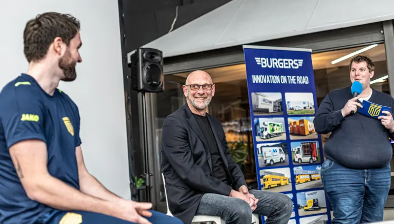 A United player and a guest during a talk show at a business event