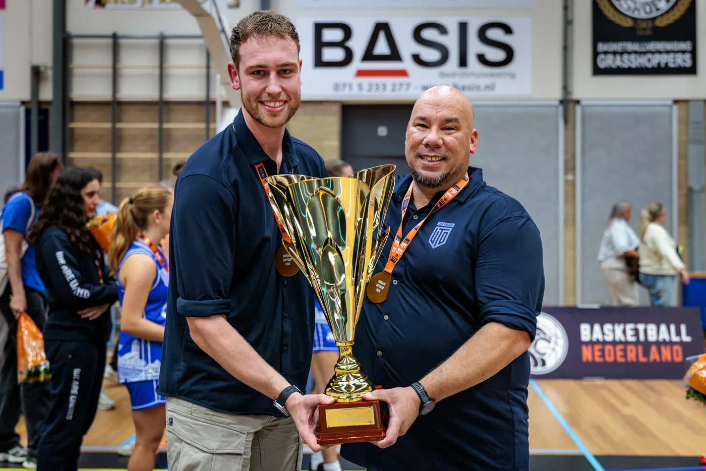 Head coach Gregory Tjin-A-Koeng with the Supercup trophy